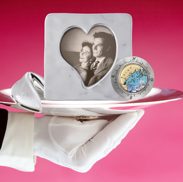 11th anniversary gifts hand holding plate with gifts on it